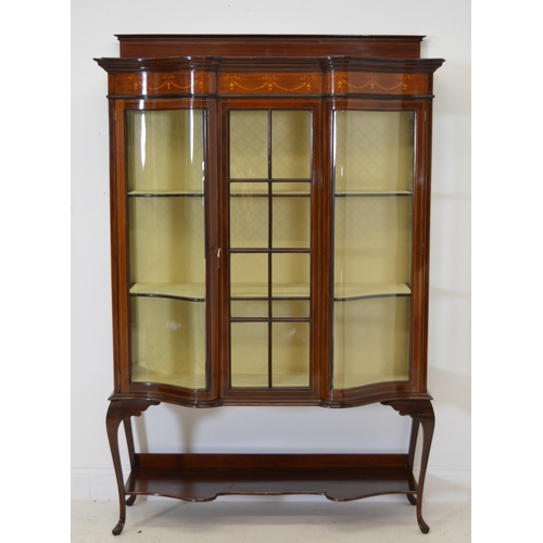 89 - Edwardian mahogany inlaid shaped front display cabinet with one glazed panelled door raised on cabri... 