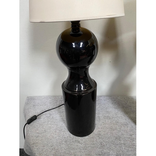 98 - Pair of Jacques Grange designer black porcelain table lamps with cloth shades.