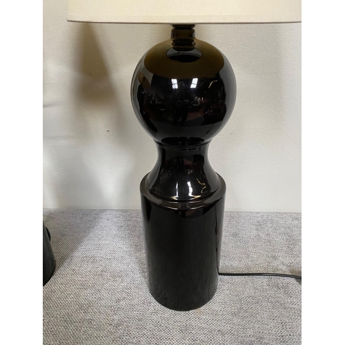 98 - Pair of Jacques Grange designer black porcelain table lamps with cloth shades.