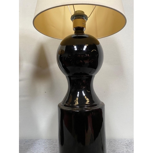 98 - Pair of Jacques Grange designer black porcelain table lamps with cloth shades.