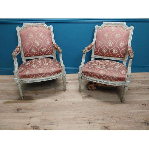 216 - Pair of 19th C. French open armchairs with carved pine frames and upholstered seats on reeded legs {... 