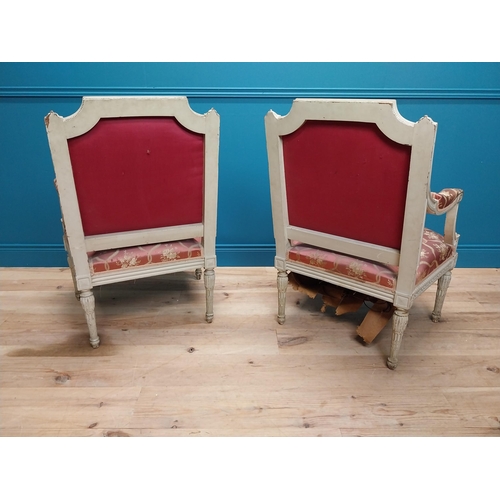 216 - Pair of 19th C. French open armchairs with carved pine frames and upholstered seats on reeded legs {... 