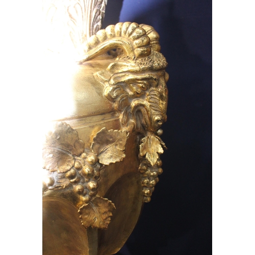 270A - Large gold lidded urn decorated with rams heads on base {H 206cm x D 70cm}.