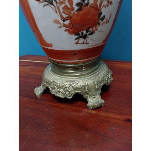 283 - Pair of 19th C. brass and ceramic oriental table lamps {34 cm H}.