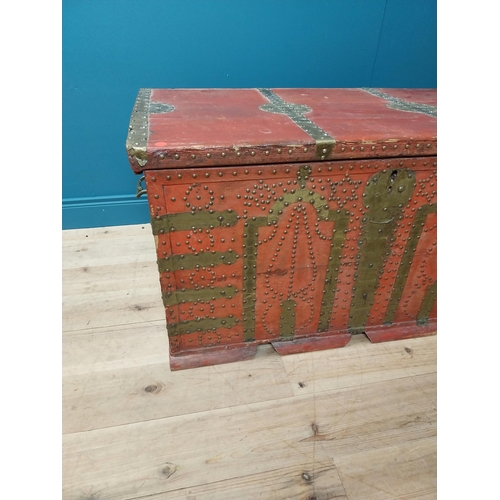 297 - Early 20th C. painted pine trunk with brass stud decoration {67 cm H x 123 cm W x 67 cm D}.