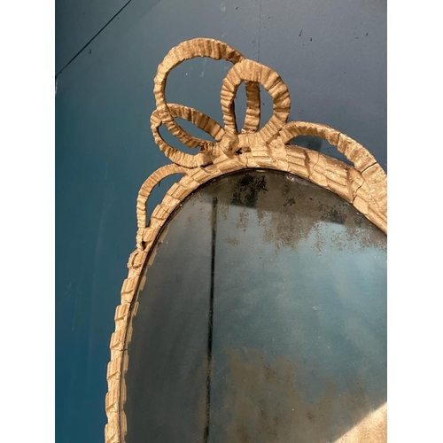 300A - Georgian painted oval mirror with original glass surmounted with bows.  { 73 cm H X 52 cm W }.