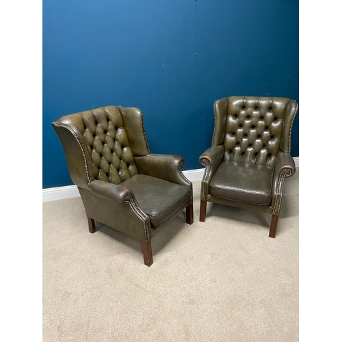 389 - Pair of deep buttoned leather upholstered wing backed  armchairs raised on square legs. { 97 cm H X ... 