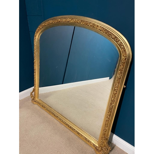 58 - Decorative gilt overmantle with bevelled plate. { 140 cm H X 150 cm W }.
