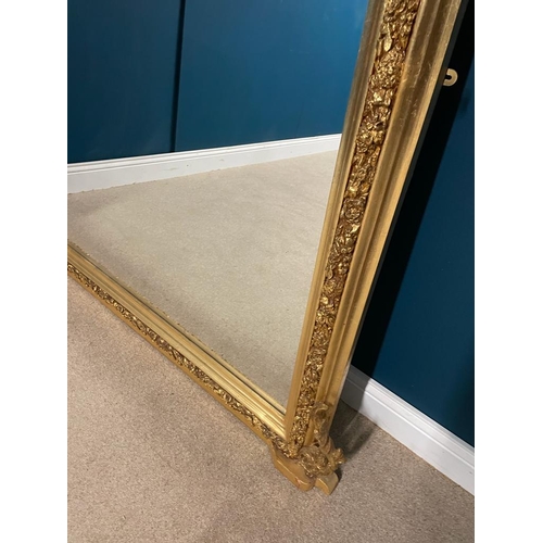 58 - Decorative gilt overmantle with bevelled plate. { 140 cm H X 150 cm W }.