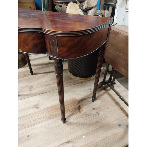 103 - Edwardian mahogany serpentine front side table raised on turned tapered reeded legs {74 cm H x 90 cm... 