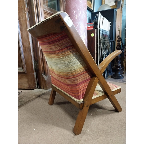 388 - Retro beech upholstered arm chair of neat proportions {70 cm H x 53 cm W x 50 cm D}.