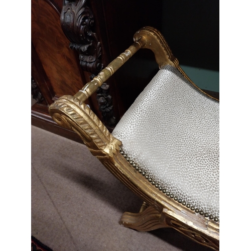 303A - Giltwood upholstered stool raised on x- framed supports.