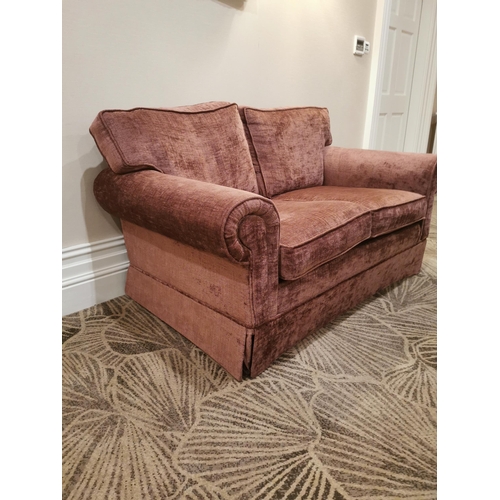 139A - Mahogany and crushed velvet upholstered two seater sofa.