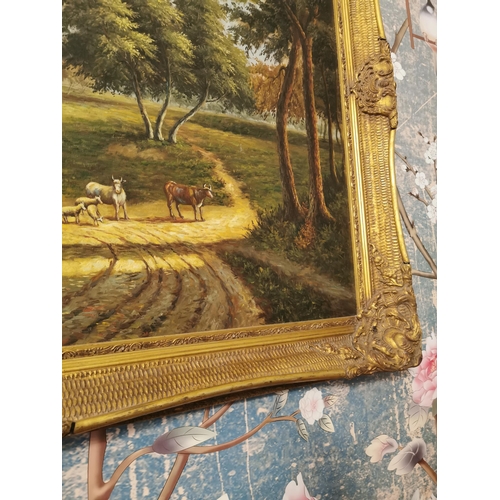 187A - Cattle grazing Oil on Canvas mounted in a gilt frame.