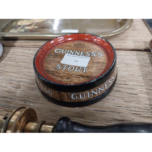 106 - Guinness Stout ashtray in form of barrel top. {4 cm H x 9 cm Diam}.