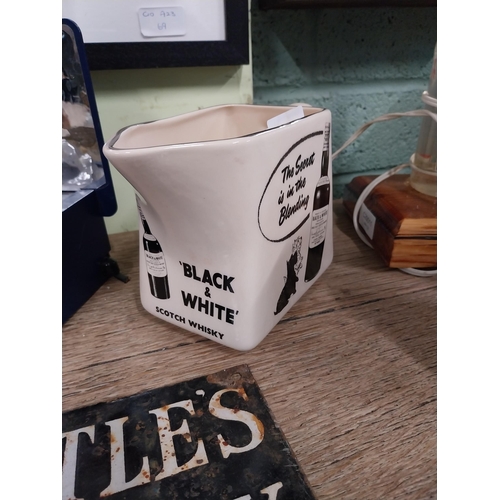 108 - Black and White Scotch Whiskey the secret is in the blend ceramic water jug. {13 cm H x 19 cm W x 8 ... 