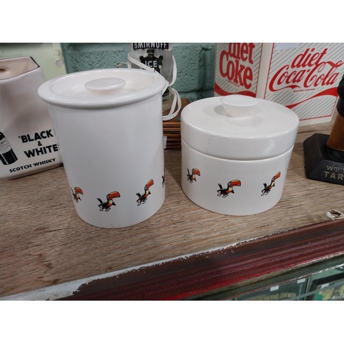 122 - Carletonware Guinness cruet set. {13 cm H x 10 cm Diam] and {9 cm H x 12 cm Diam}.