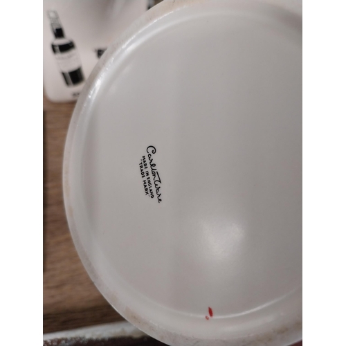 122 - Carletonware Guinness cruet set. {13 cm H x 10 cm Diam] and {9 cm H x 12 cm Diam}.