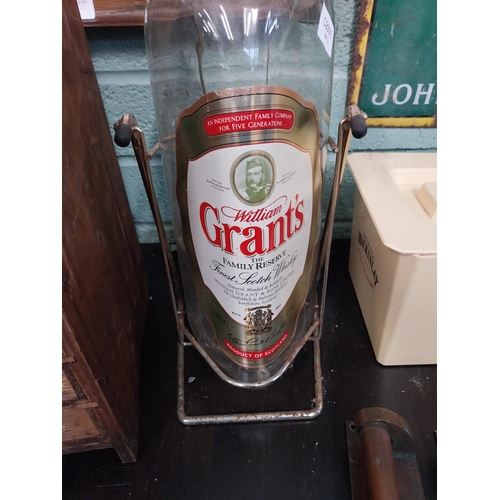 159 - Grants Whiskey advertising bottle on stand. {55 cm H x 19 cm W x 19 cm D}.
