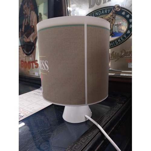 17 - Ceramic Guinness advertising lamp with original shade. {28 cm H x 22 cm Diam}.
