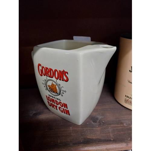 33 - Gordon's London Dry Gin ceramic advertising jug. {13 cm H x 17 cm W x 9 cm D}.