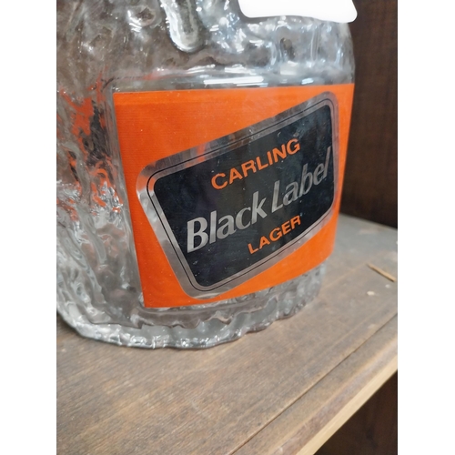 38 - Carling Black Label glass decanter. {21 cm H x 12 cm Diam}.