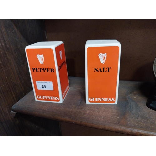 39 - Guinness plastic salt and pepper set. {13 cm H x 7 cm W x 7 cm D}.