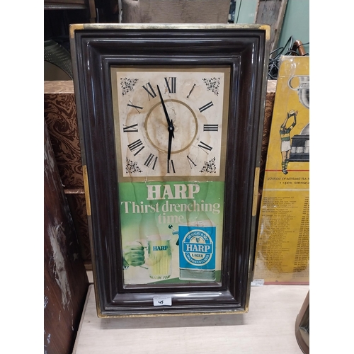 45 - 1970's Harp Lager battery operated advertising clock. {59 cm H x 35 cm W x 8 cm D}.