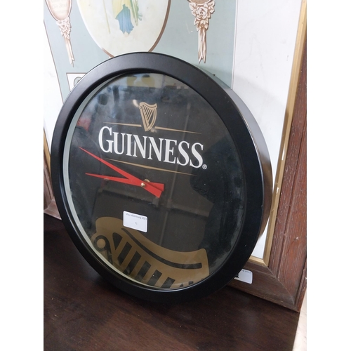 71 - Guinness tin plate advertising clock {31 cm Diam}.