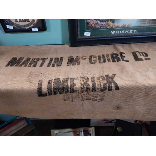 77 - Martin Maguire of Limerick 100 with sack bag. {126 cm H x 69 cm W}.