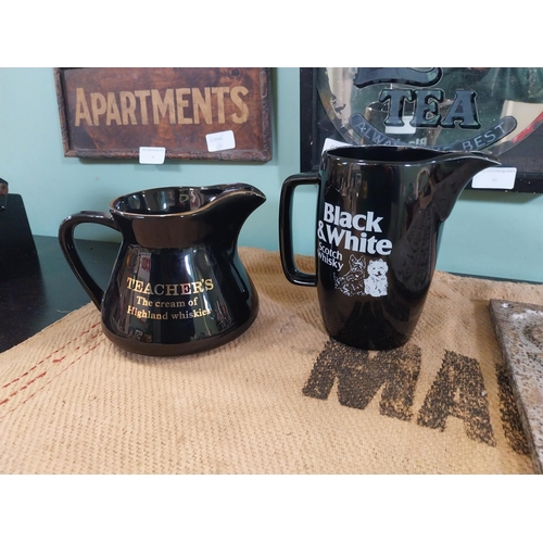 78 - Black and White Scotch Whiskey and Wade Teachers Whiskey ceramic advertising jugs. {16 cm H x 17 cm ... 