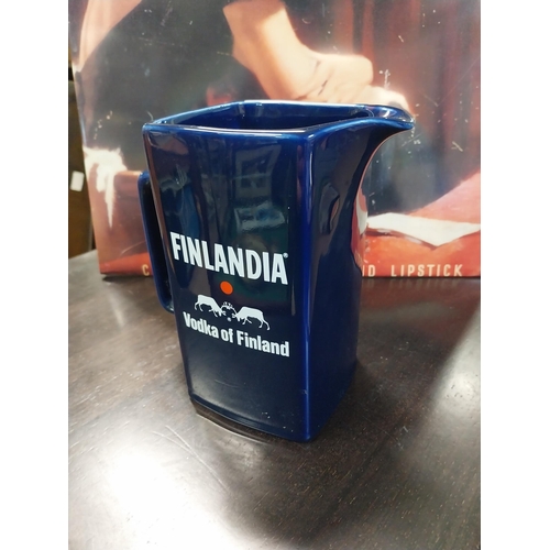 83 - Finlandia Vodka Wade ceramic advertising jug. {17 cm H x 15 cm W x 9 cm D}.