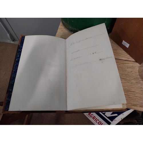 92 - P McVey and Sons Coagh Co Tyrone leather bound shop ledger. {34 cm H x 22 cm W}.