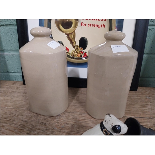 96 - Two early 20th C. stoneware hot water bottles. {23 cm H x 12 cm W x 13 cm D}.