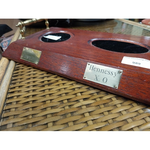 989 - Mahogany and brass Hennessy bottle stand. {7 cm H x 55 cm W x 19 cm D}.