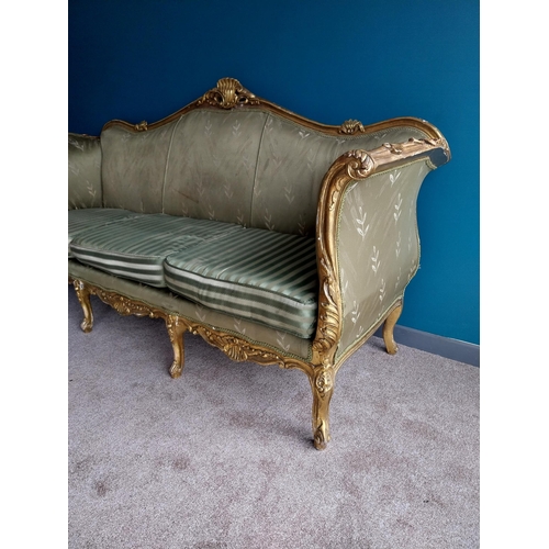 42 - Decorative hand carved giltwood and upholstered three seater sofa in the French style {116 cm H x 23... 