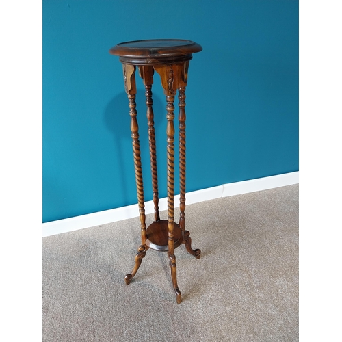 48 - Mahogany jardini�re stand raised on barley twist columns and four outswept legs {102 cm H x 30 cm Di... 