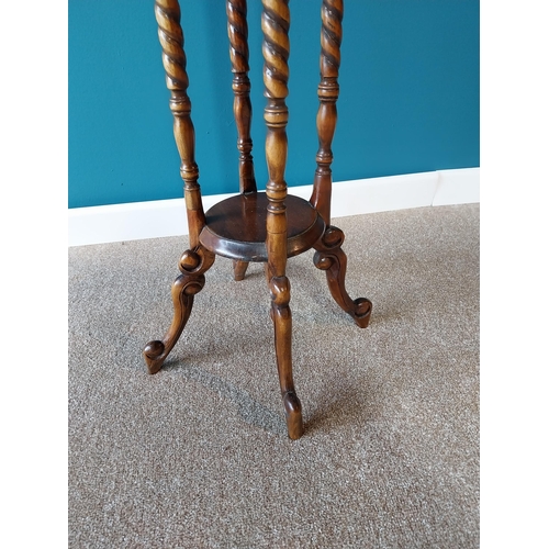 48 - Mahogany jardini�re stand raised on barley twist columns and four outswept legs {102 cm H x 30 cm Di... 