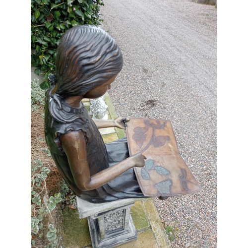 36 - Bronze figure of a Girl reading {H 60cm x W 37cm x D 50cm}