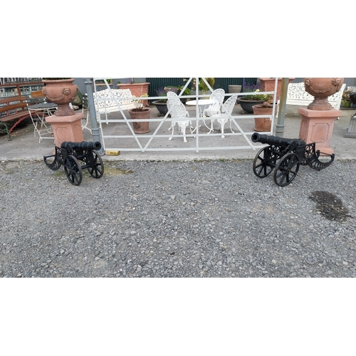 6 - Pair of good quality cast iron Cannons in the Georgian style {70 cm H x 156 cm W x 38 cm D}.