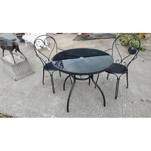 8 - Wrought iron garden table with inset glass top and two matching chairs {73 cm H x 80 cm Dia 90 cm H ... 