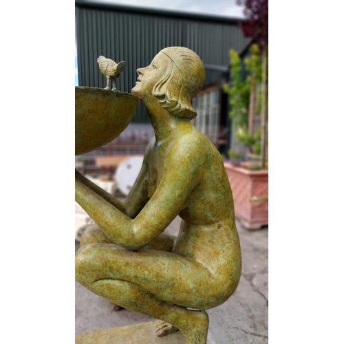 21 - Exceptional quality bronze water feature in the form of an Art Deco lady raised on cut limestone ped... 