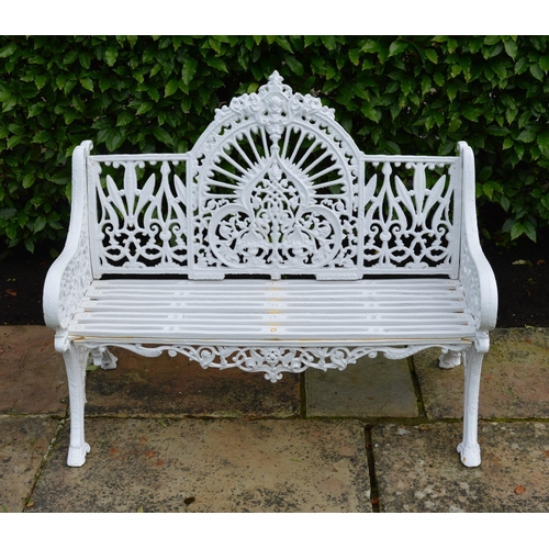 49 - Cast iron arched back garden seat in the Pierce of Wexford style {100 cm H x 120 cm W}.