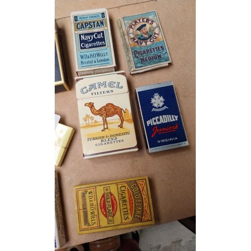 102 - Eight cigarette advertising packets - Camel, piccadilly.