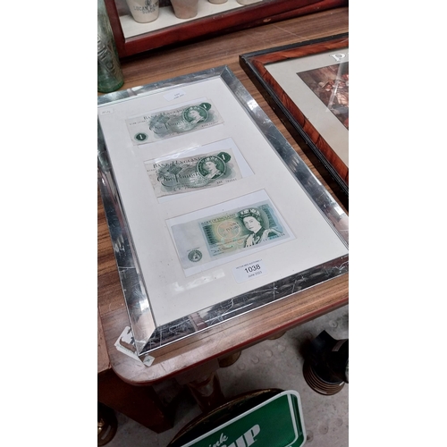 1038 - Framed set of Bank of England �1 notes. {47 cm H x 29 cm W}.