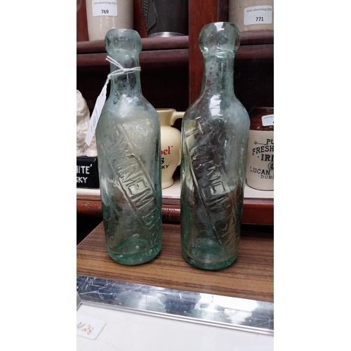 1039 - Two 19th C. Twinems of Dublin blop top bottles. {23 cm H}