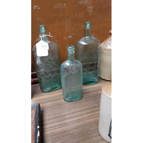 1043 - Three 19th C. bottles - Sir J Murray Fluid Magnesia.{25 cm H to 21 cm H}.