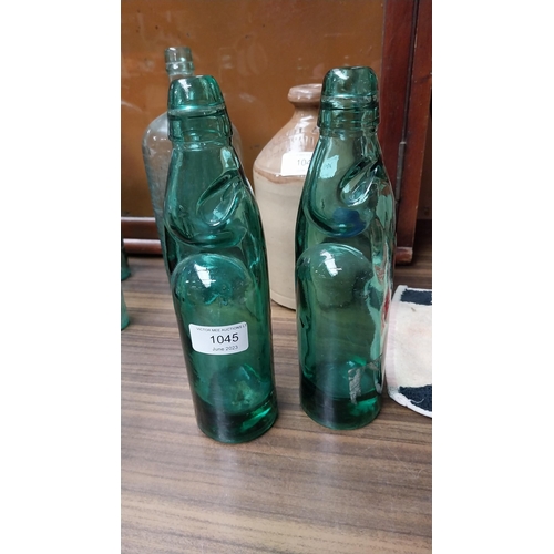 1045 - Two repro cod bottles {24 cm H}.