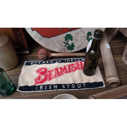 1048 - Glass beer bottle Toomeys of Limerick {23 cm H} and Beamish bar towel mat [20 cm H x 40 cm W}.