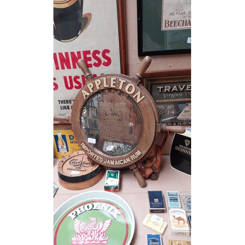 105 - Appleton Jamaican Rum advertising mirror in the form of a Ship's wheel with damage. {60 cm Dia}.